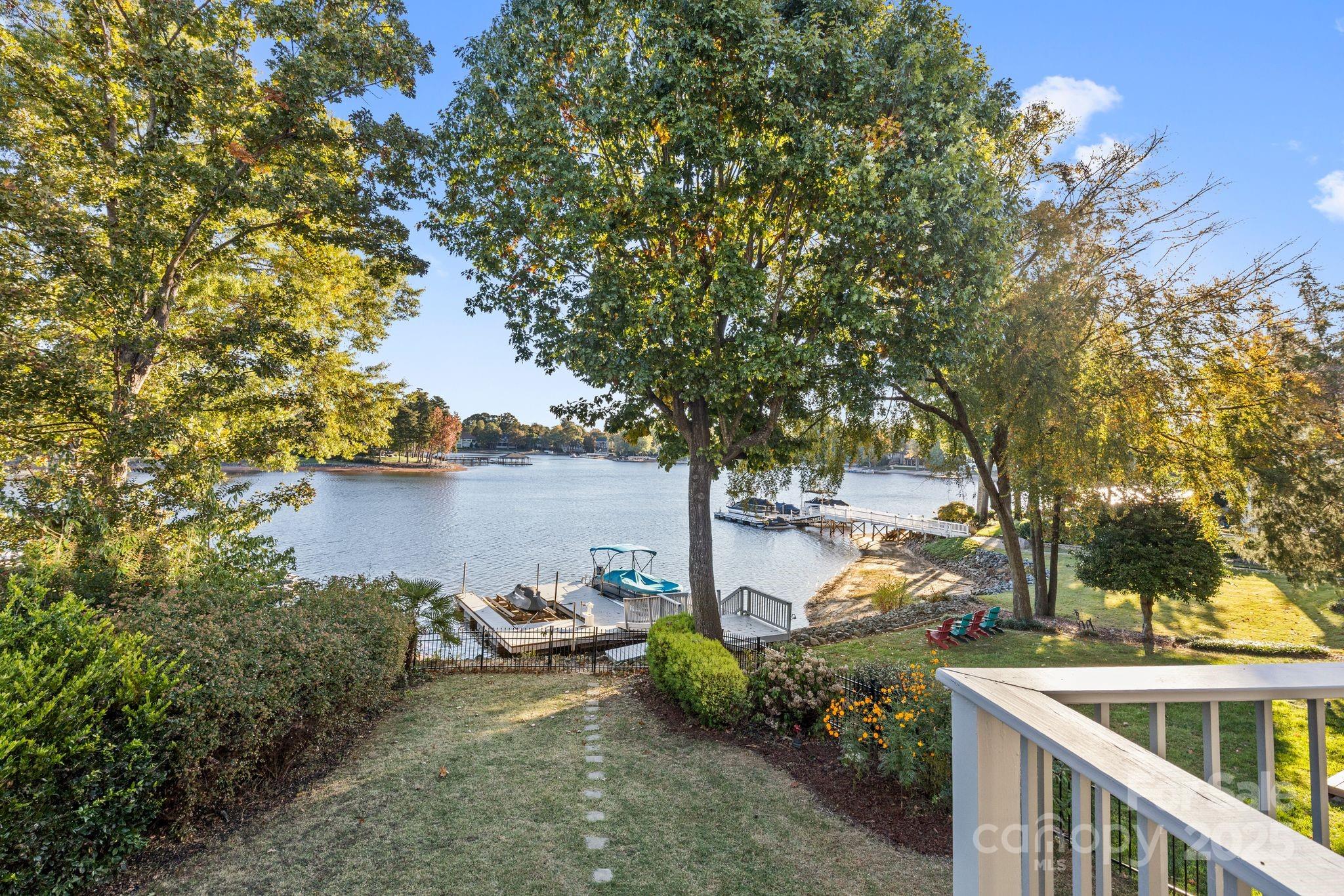17701 Springwinds Drive Cornelius, NC 28031 - Photo 28 of 48 a view of a lake with houses