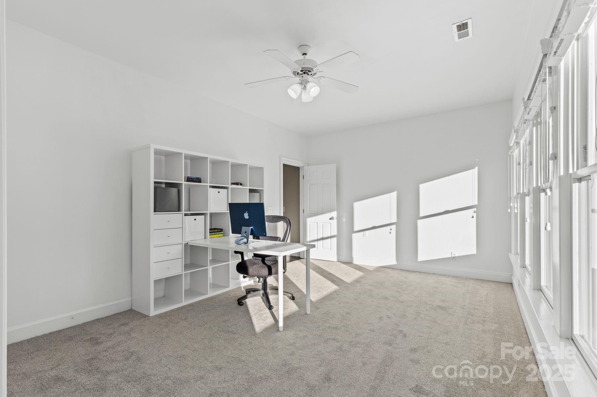17701 Springwinds Drive Cornelius, NC 28031 - Photo 35 of 48 a view of work space with furniture and a window