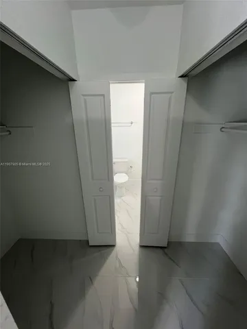 a stove top oven sitting inside of a kitchen