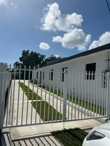 a view of balcony with wooden floor and fence