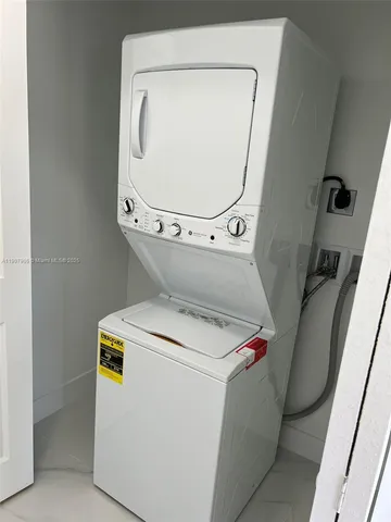 a view of a hallway with a window