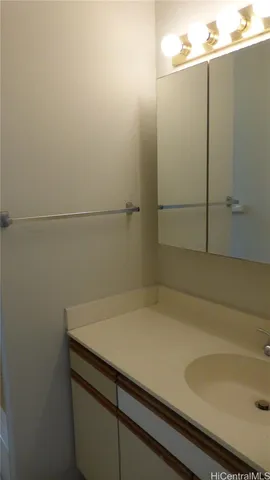a bathroom with a sink and cabinets