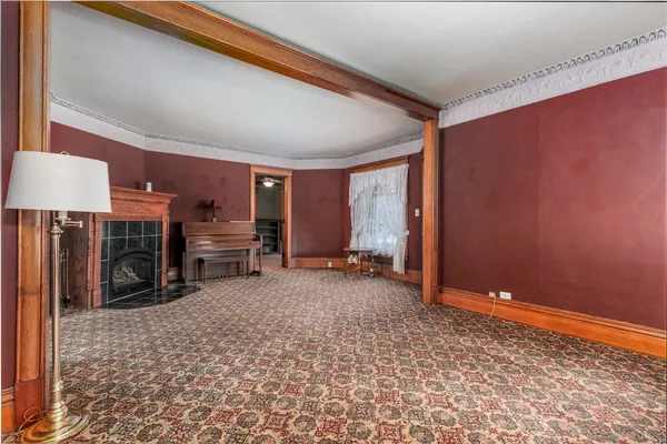 a view of an entryway with wooden floor and door