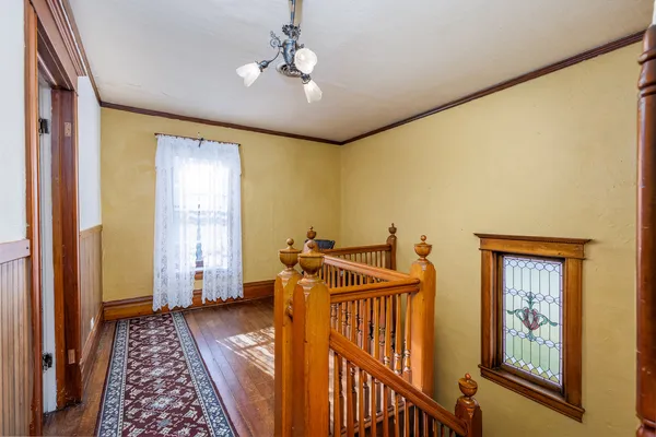 an empty room with closet and ceiling fan