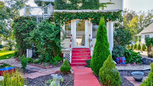 a backyard of a house with lots of green space