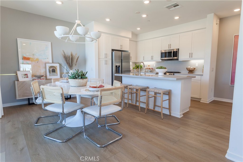 18646 Rorimer Street La Puente, CA 91744 - Photo 12 of 24 a living room with stainless steel appliances kitchen island granite countertop furniture a rug kitchen view and a chandelier