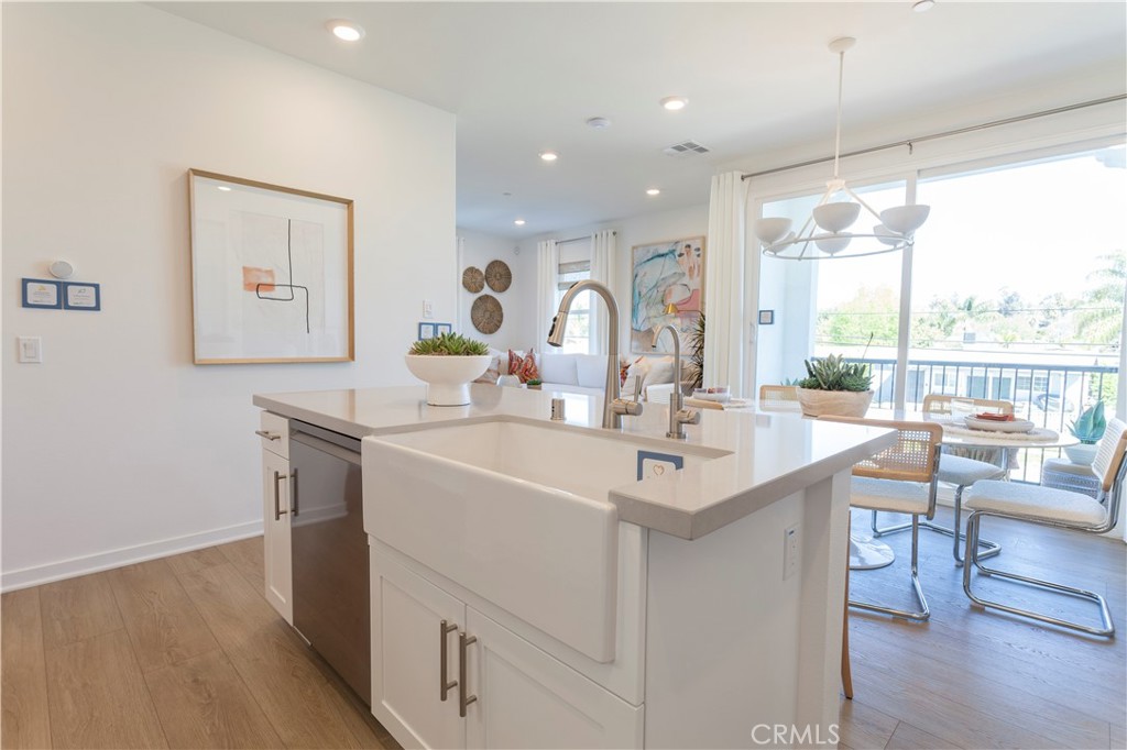 18646 Rorimer Street La Puente, CA 91744 - Photo 14 of 24 a kitchen with a sink appliances and wooden floor