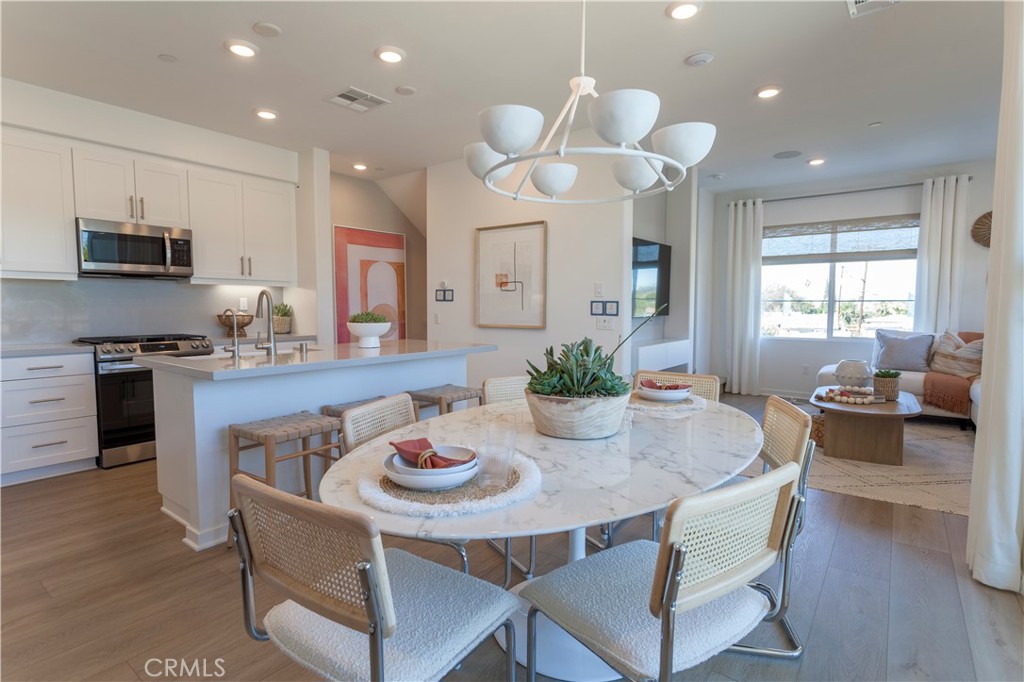 18646 Rorimer Street La Puente, CA 91744 - Photo 16 of 24 a kitchen with a table and chairs in it