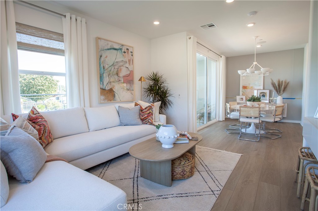 18646 Rorimer Street La Puente, CA 91744 - Photo 17 of 24 a living room with furniture and wooden floor
