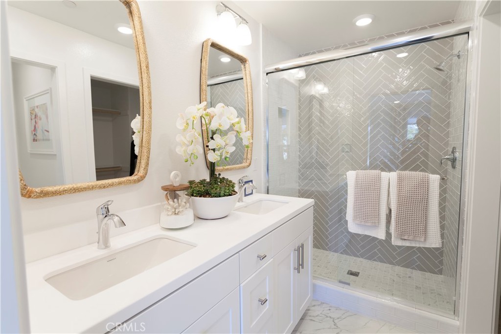 18646 Rorimer Street La Puente, CA 91744 - Photo 21 of 24 a bathroom with a sink and a mirror