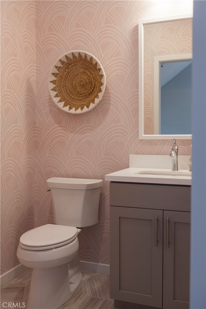 18646 Rorimer Street La Puente, CA 91744 - Photo 6 of 24 a bathroom with a sink mirror vanity and toilet