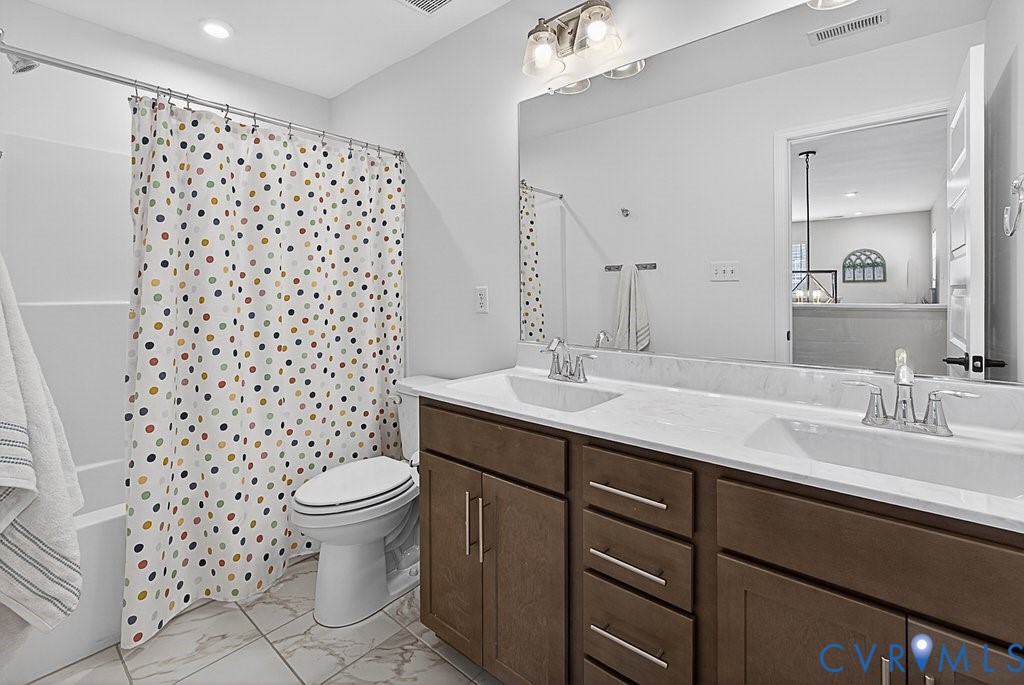 18517 Palisades Ridge Moseley, VA 23120 - Photo 31 of 55 a bathroom with a sink toilet and shower