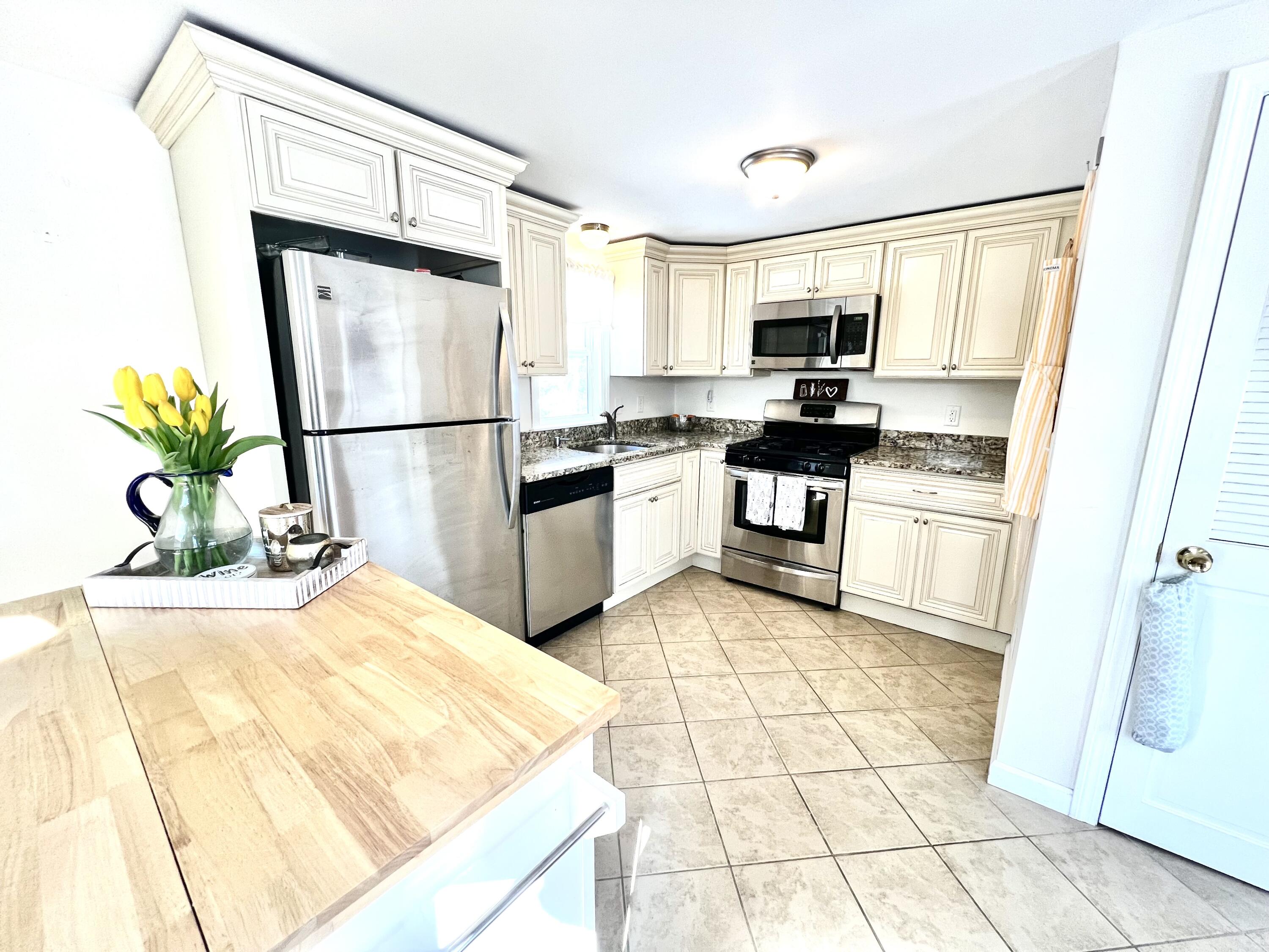 79 Handy Road Pocasset, MA 02559 - Photo 3 of 10 a kitchen with stainless steel appliances granite countertop a refrigerator sink and stove