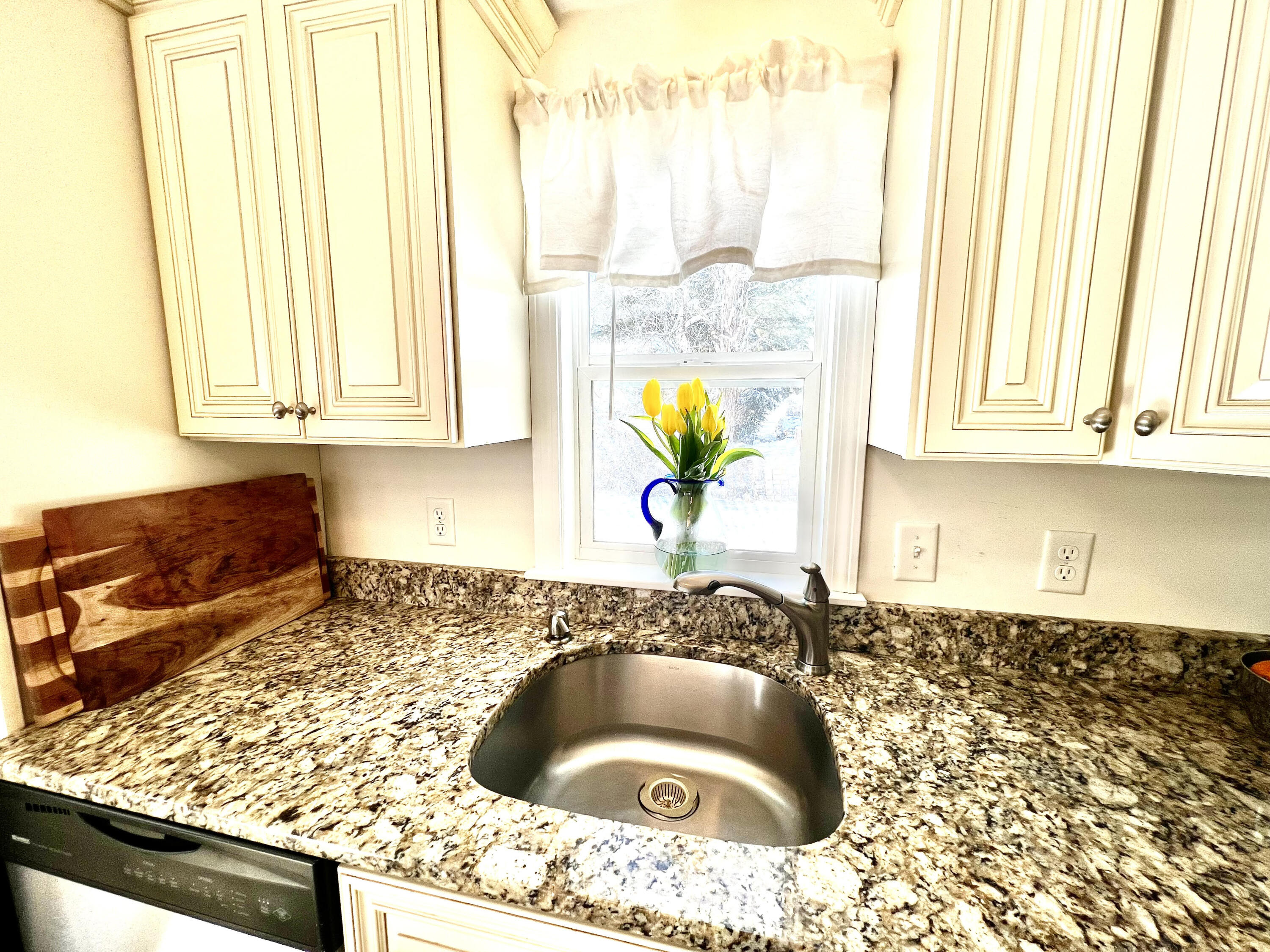 79 Handy Road Pocasset, MA 02559 - Photo 4 of 10 a kitchen with a granite countertop sink and a granite counter tops