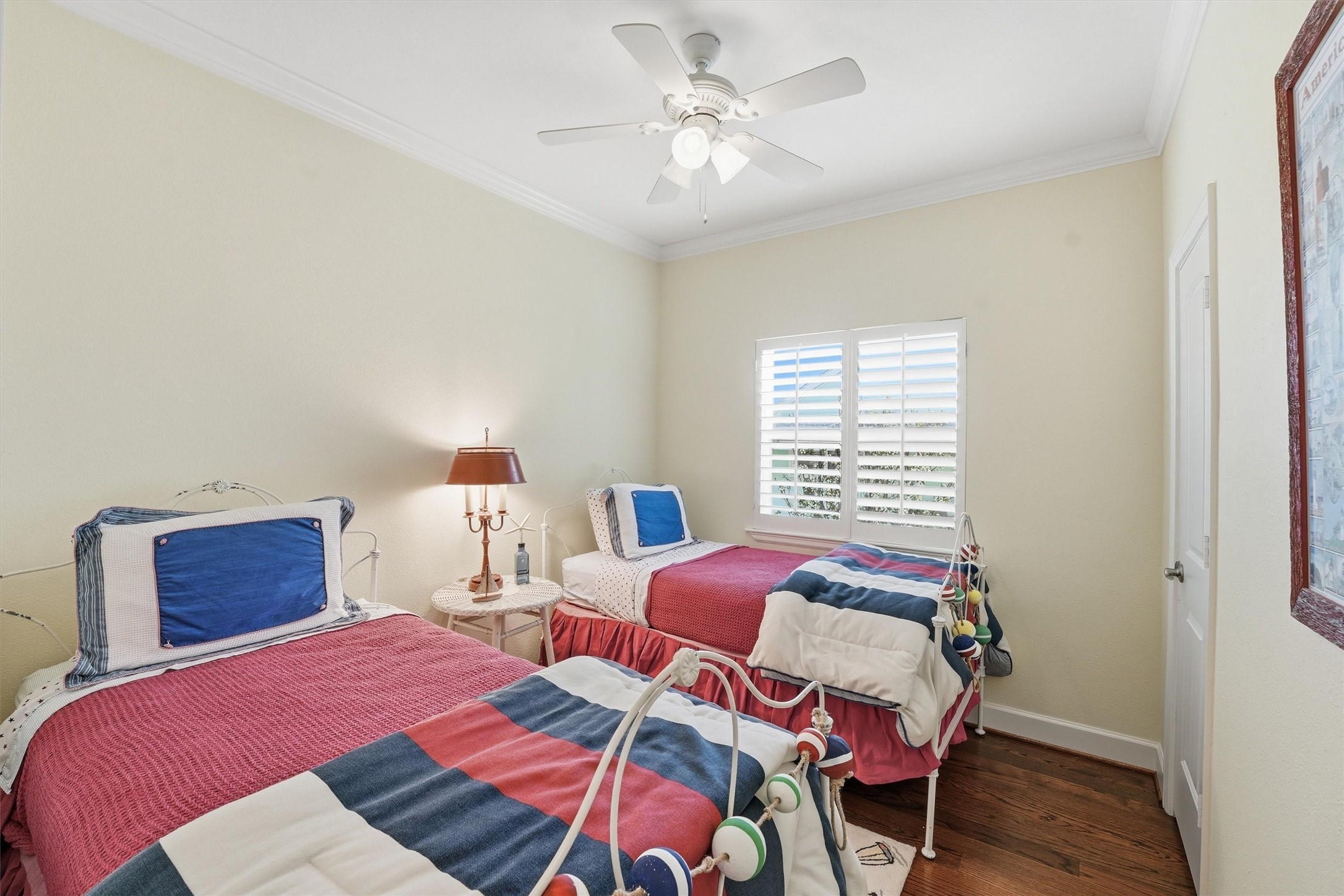 16635 Jamaica Cove Road Jamaica Beach, TX 77554 - Photo 28 of 45 a bedroom with two beds and a chandelier
