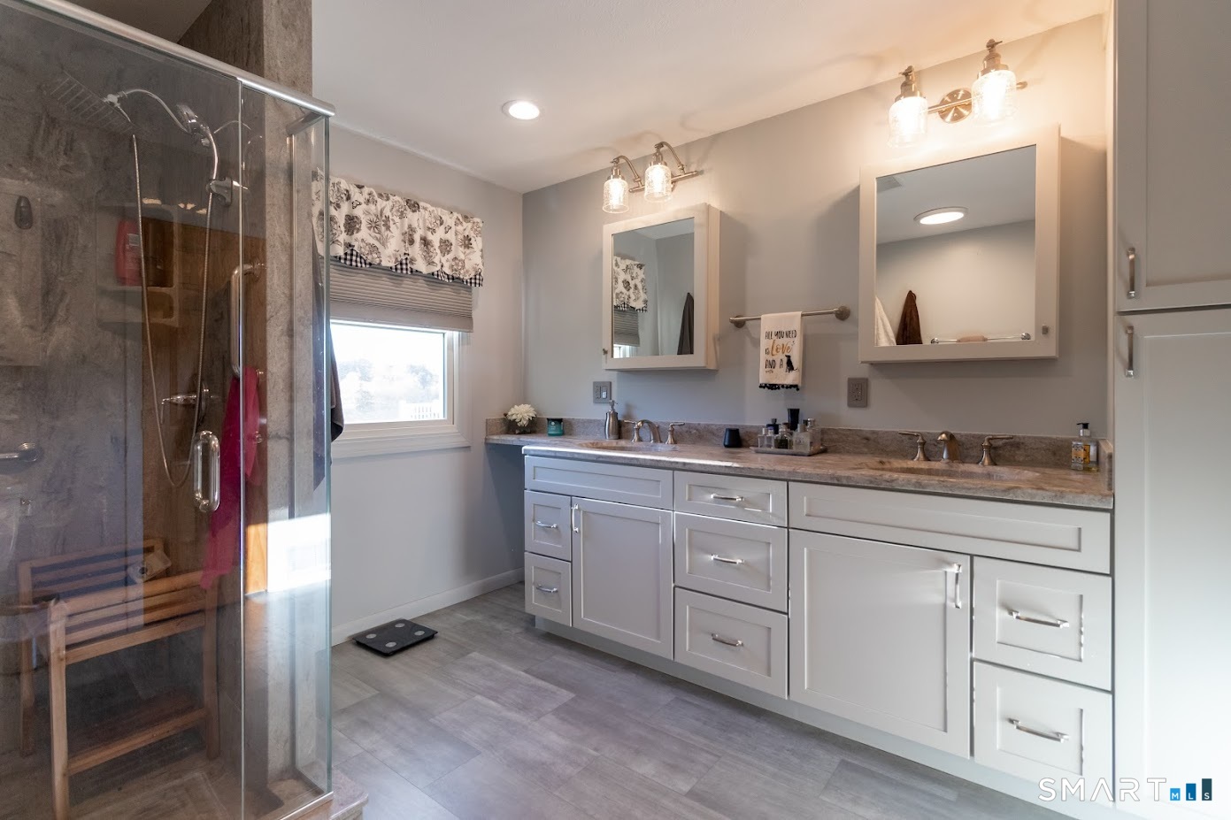 763 North Street Suffield, CT 06078 - Photo 28 of 40 a bathroom with a granite countertop sink mirror and double