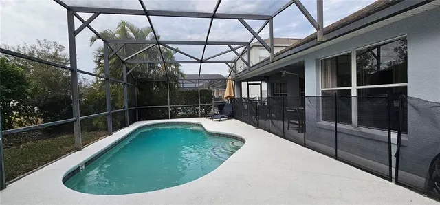 a view of a chairs and table in the patio