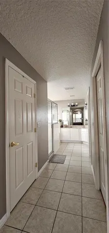 a bathroom with a glass door shower
