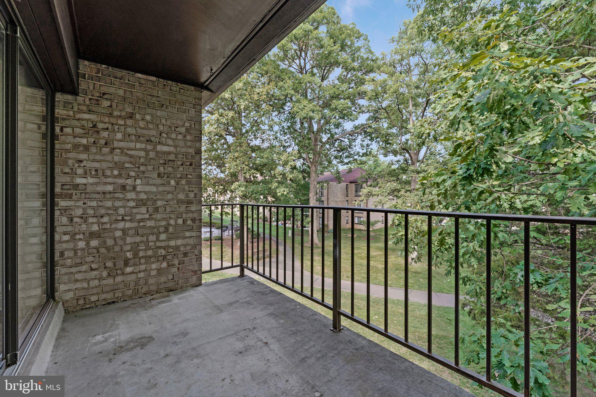 2012 Colts Neck Road, Unit 21A Reston, VA 20191 - Photo 30 of 44 Serene balcony with lush views.