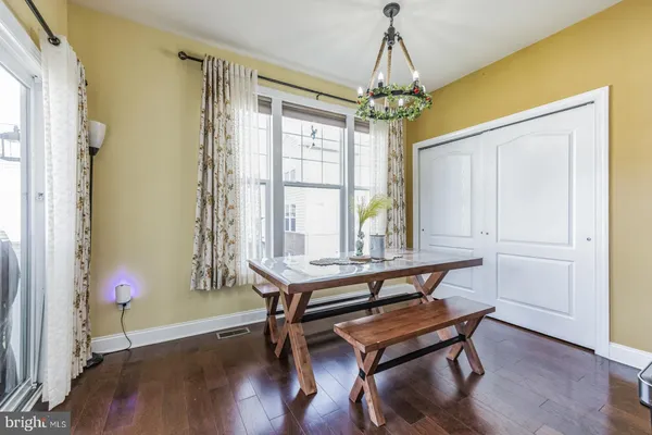 a view of a room with furniture window and wooden floor