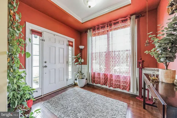 a very nice looking room with a large window and a rug