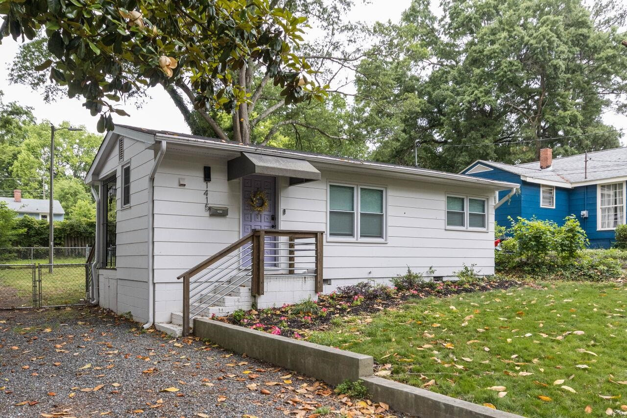 1415 Berkeley Street Durham, NC 27705 - Photo 1 of 24 front view of a house with a yard