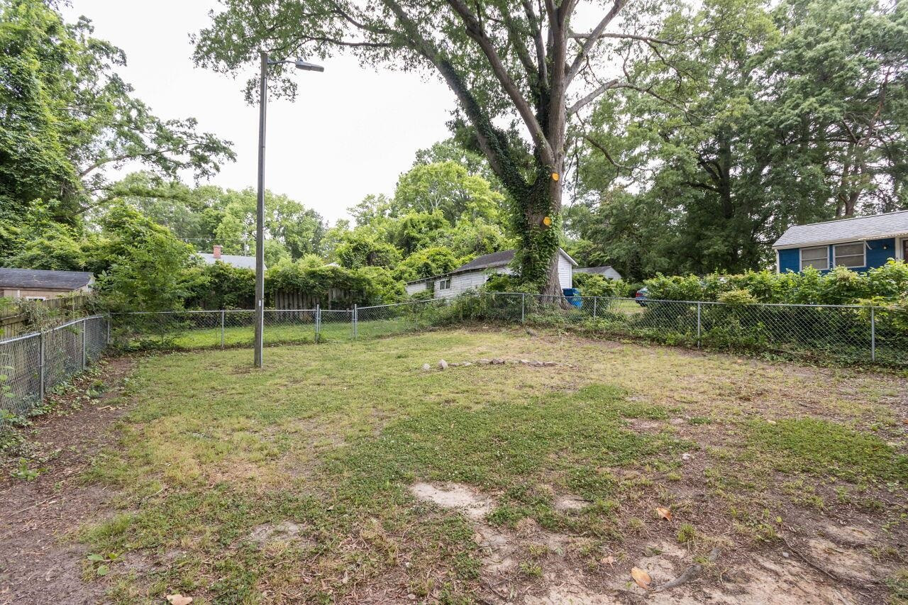 1415 Berkeley Street Durham, NC 27705 - Photo 22 of 24 a view of a yard with a tree