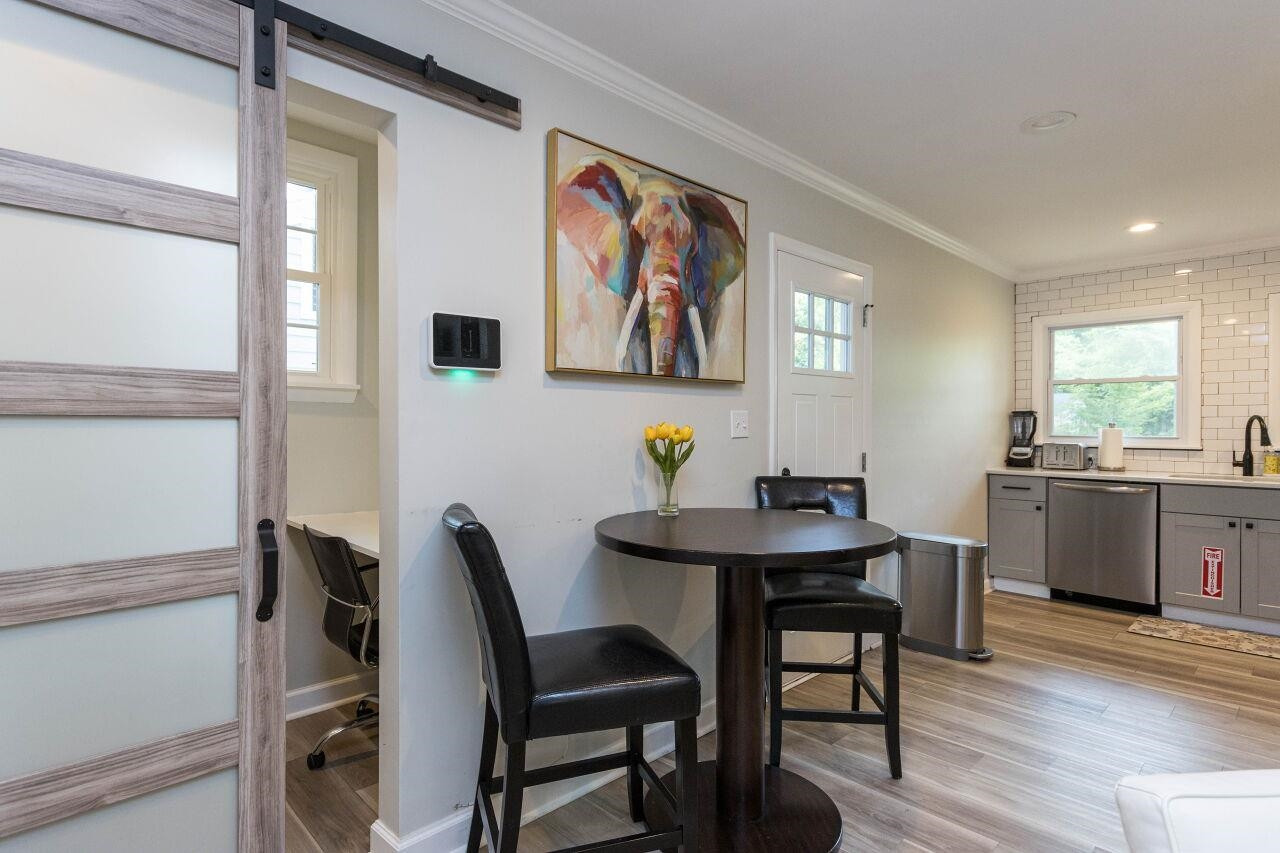 1415 Berkeley Street Durham, NC 27705 - Photo 7 of 24 a view of a workspace with furniture and window
