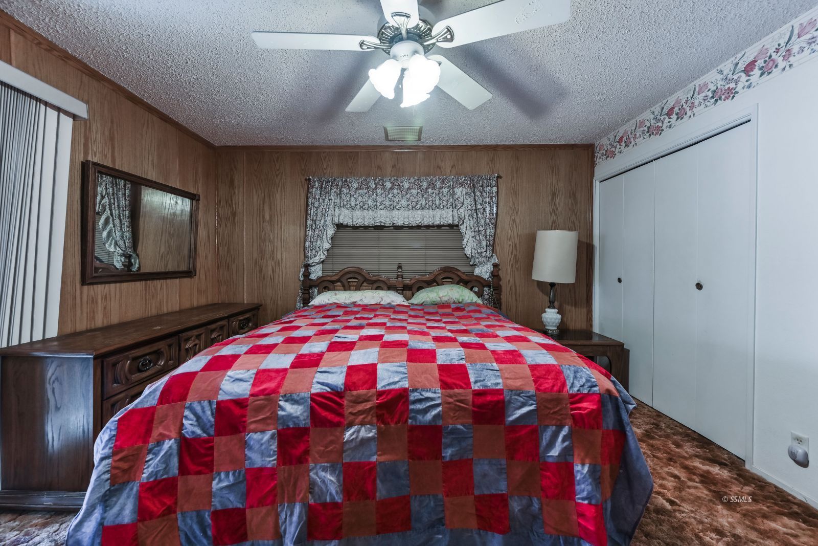 601 South Silver Ridge Street Ridgecrest, CA 93555 - Photo 27 of 34 a bedroom with a bed and a chandelier