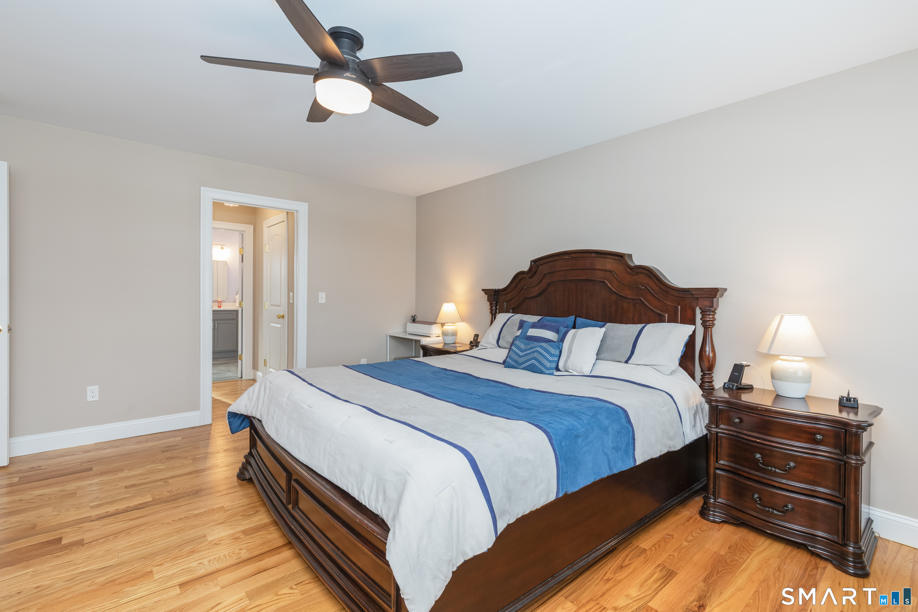 23 North Street Wolcott, CT 06716 - Photo 11 of 30 a bedroom with a bed and wooden floor