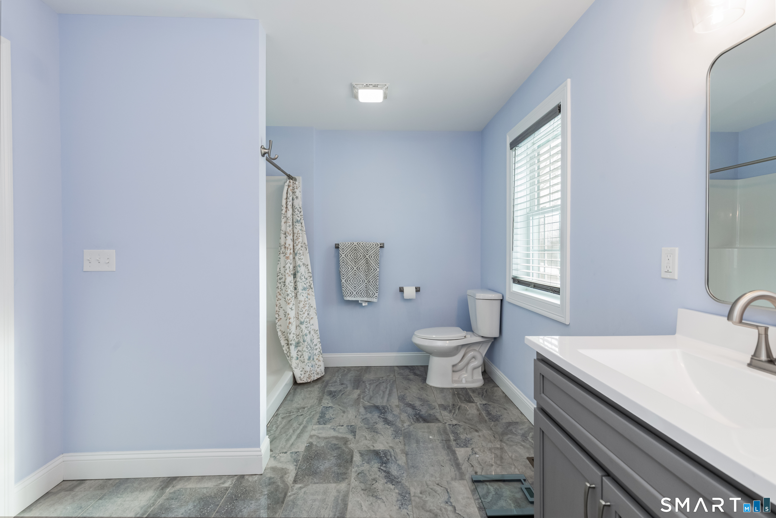 23 North Street Wolcott, CT 06716 - Photo 15 of 30 a bathroom with a sink a toilet and window