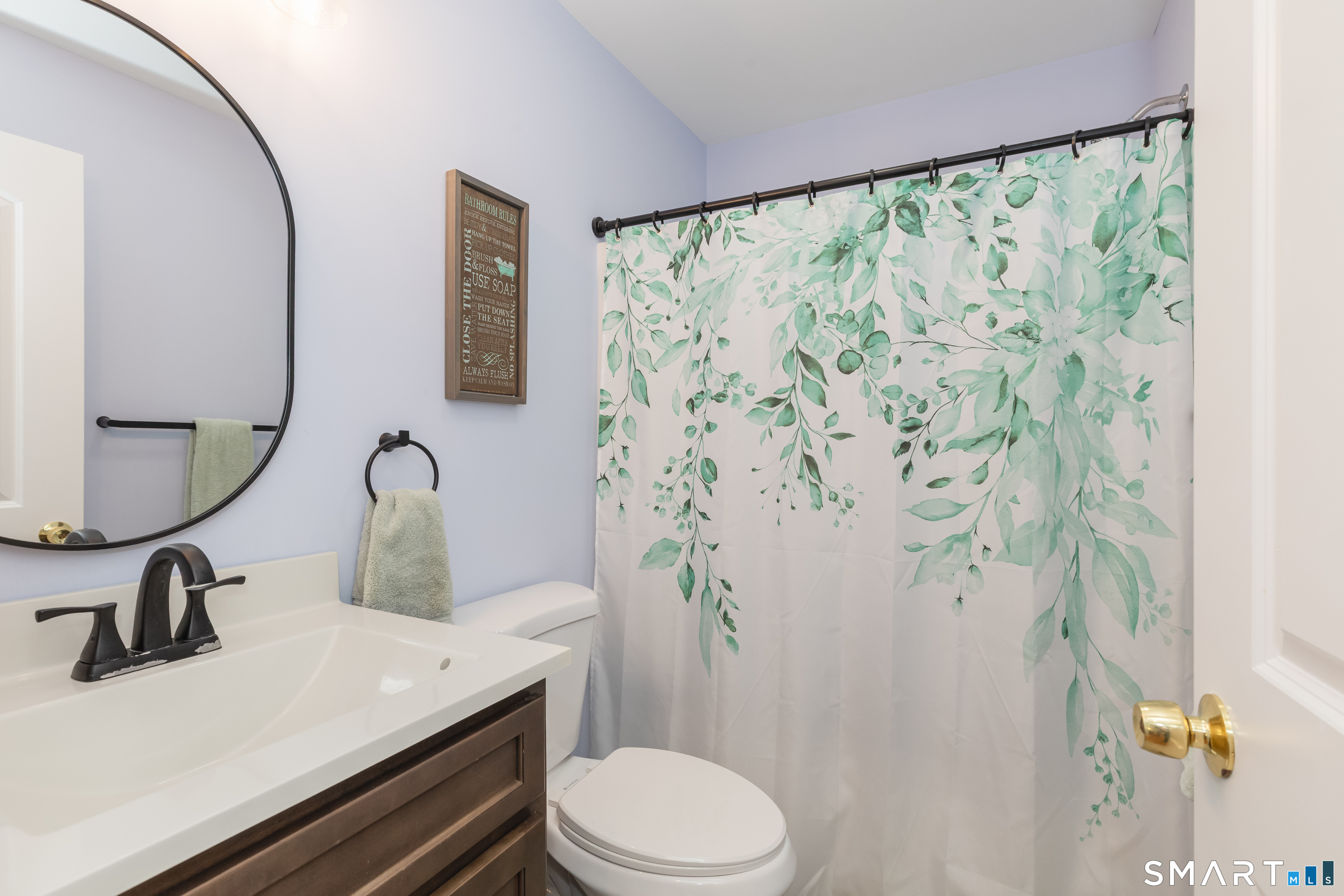 23 North Street Wolcott, CT 06716 - Photo 21 of 30 a bathroom with a sink toilet and a mirror