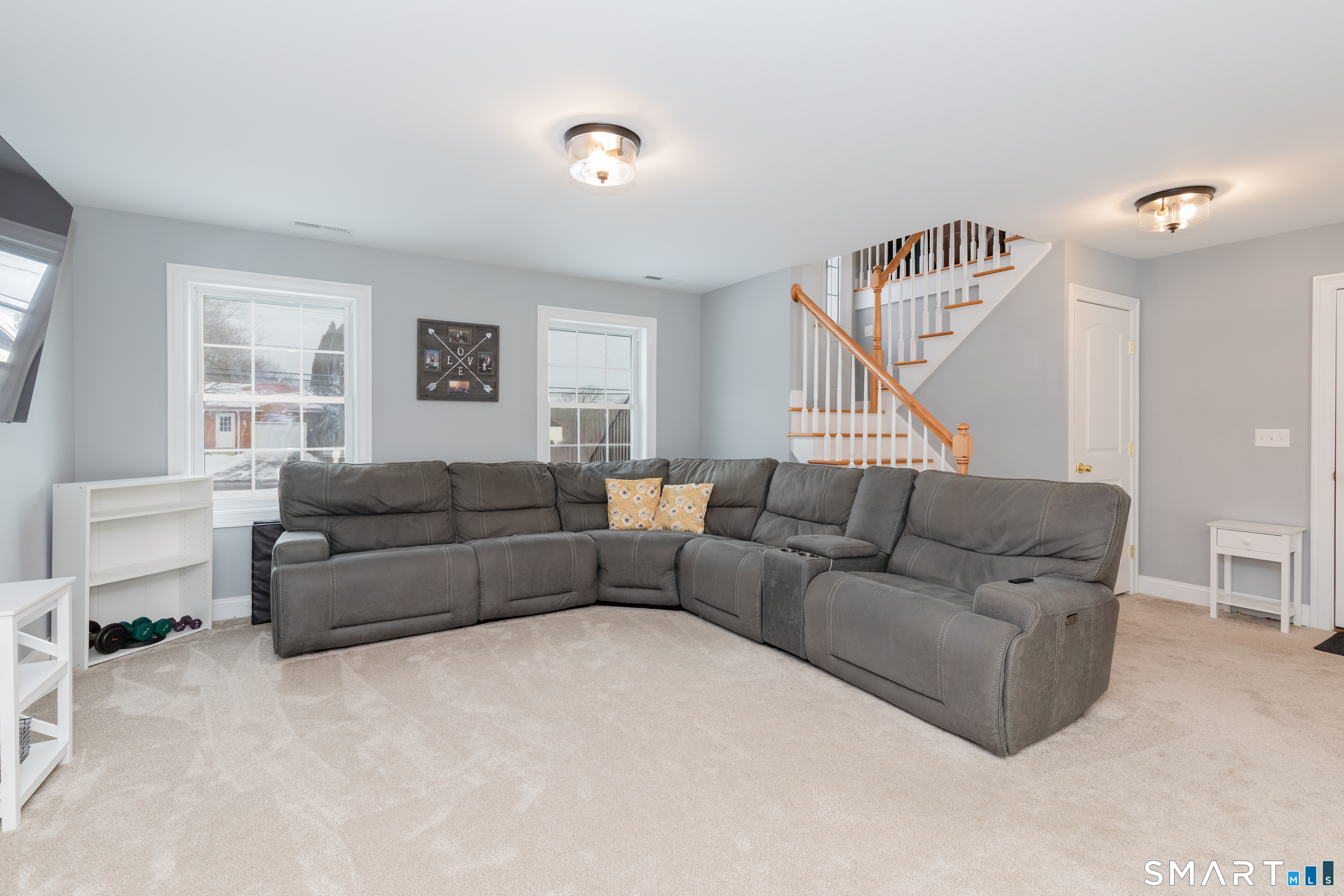 23 North Street Wolcott, CT 06716 - Photo 22 of 30 a living room with furniture a ceiling fan and a window