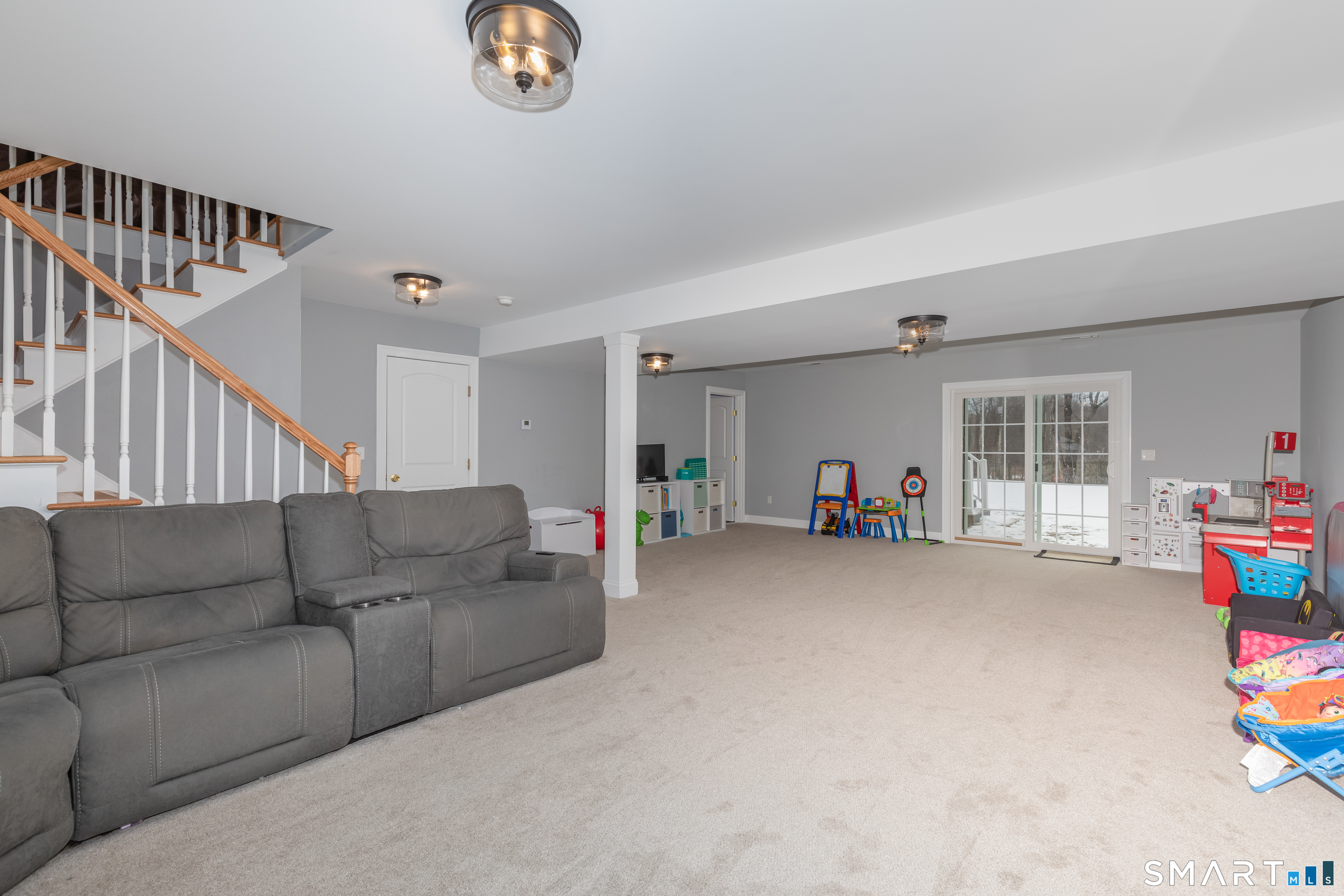 23 North Street Wolcott, CT 06716 - Photo 24 of 30 a living room with furniture and a flat screen tv