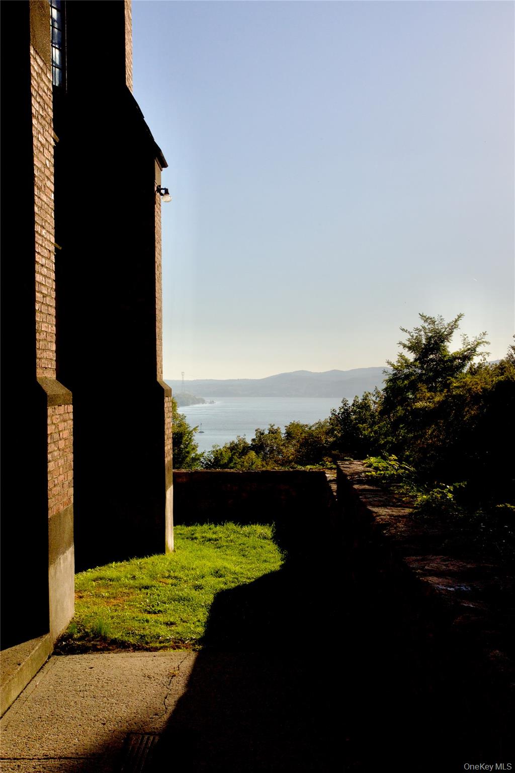 305 Chateau Rive, Unit 305 Peekskill, NY 10566 - Photo 15 of 22 View of green lawn featuring a mountain view
