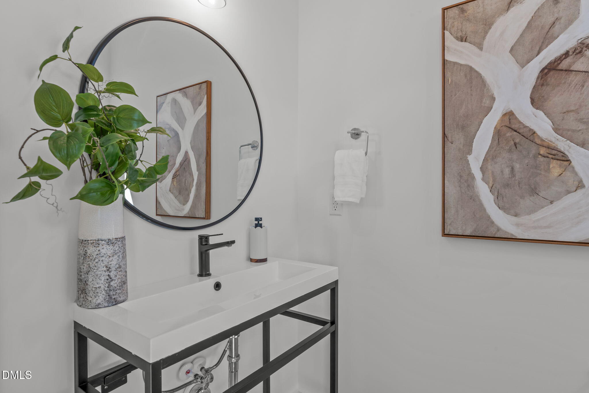 2004 Moody Durham, NC 27701 - Photo 11 of 43 a bathroom with a sink a mirror and a fan
