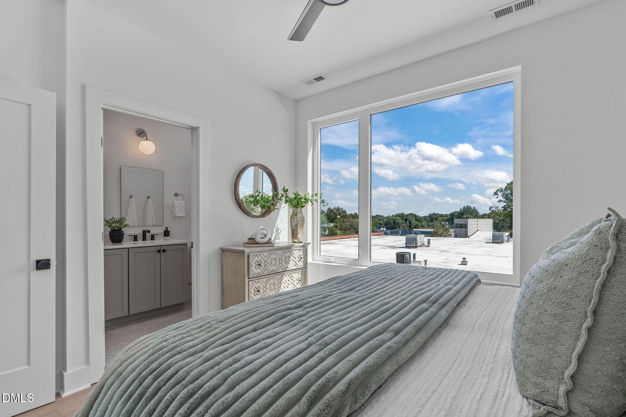 2004 Moody Durham, NC 27701 - Photo 19 of 43 a bedroom with a large bed and a large window