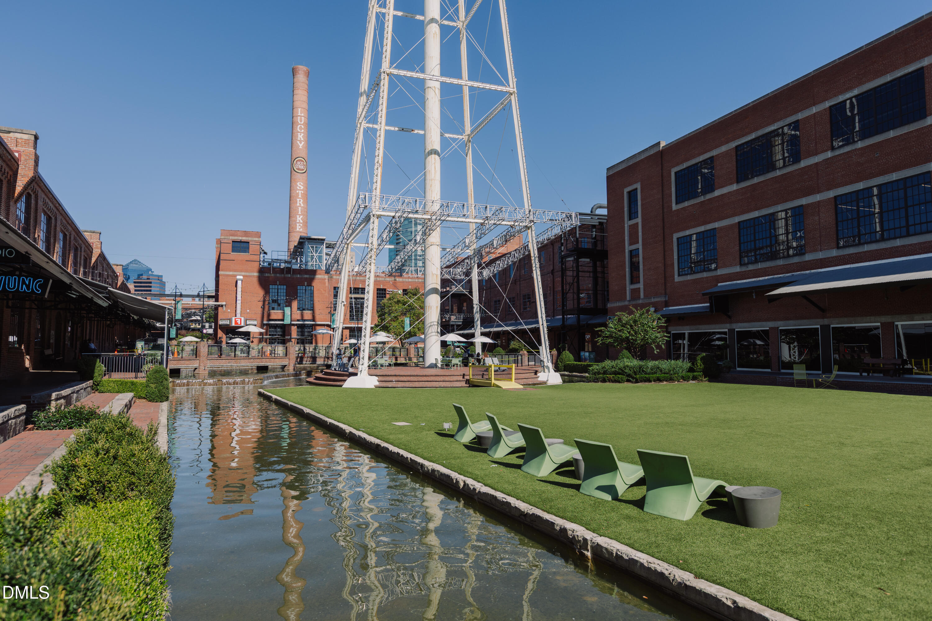 2004 Moody Durham, NC 27701 - Photo 41 of 43 a front view of multi story residential apartment building with yard and outdoor seating