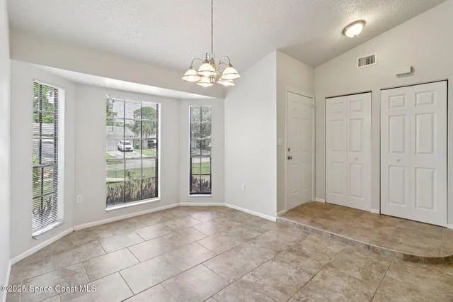 a view of a kitchen with a sink and dishwasher cabinets