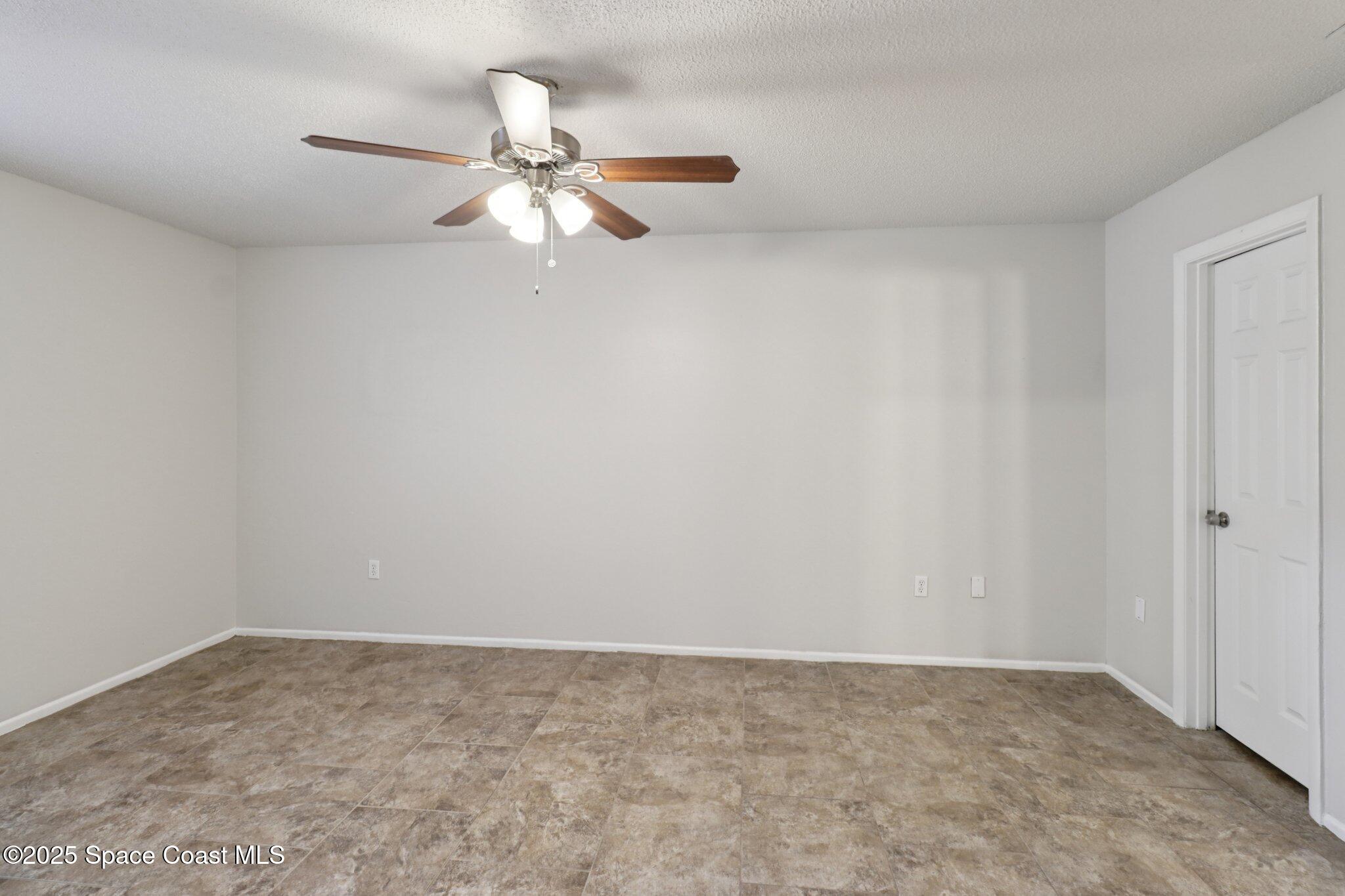 5215 Holden Road Cocoa, FL 32927 - Photo 19 of 34 a view of an empty room and window
