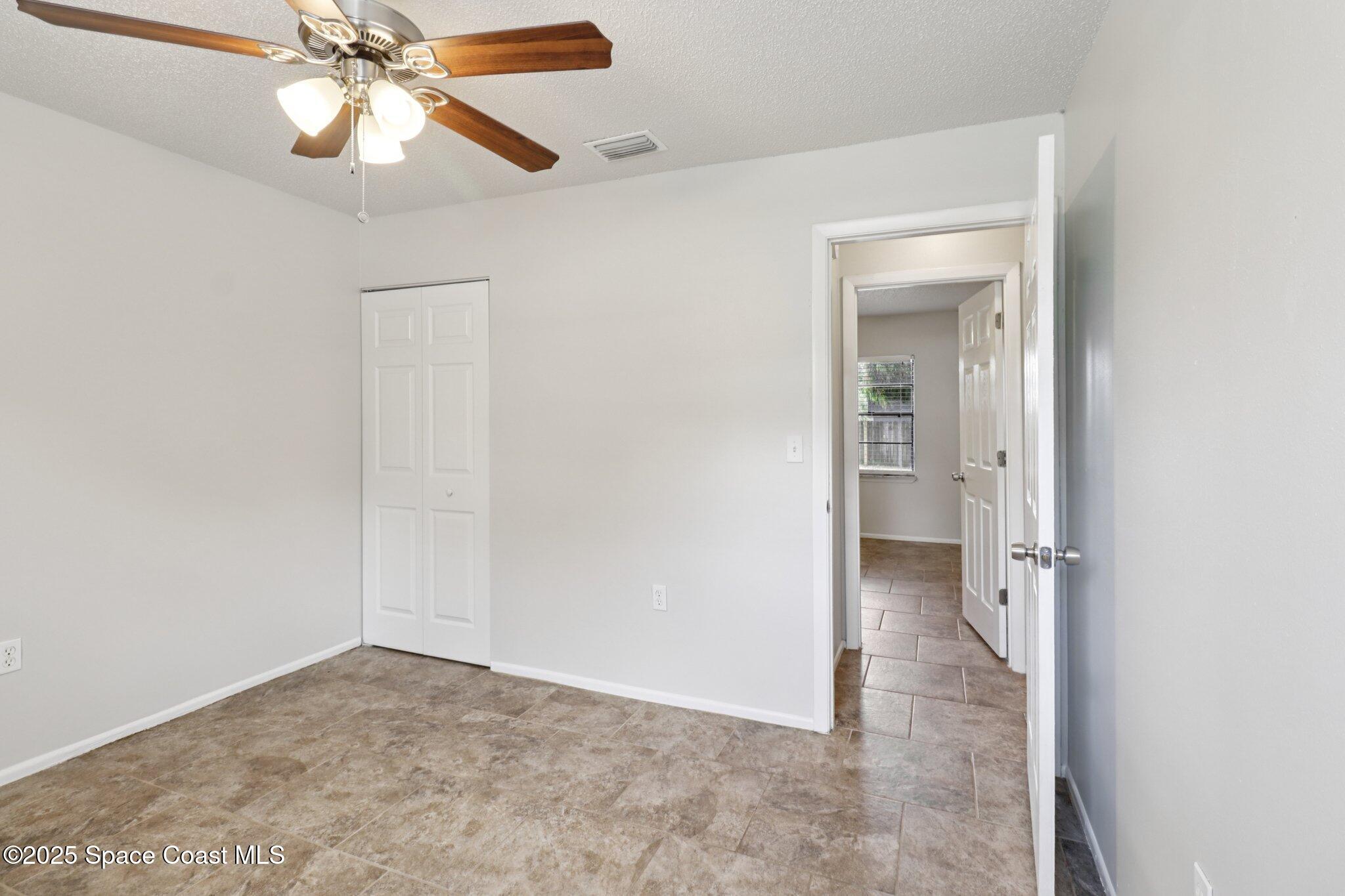 5215 Holden Road Cocoa, FL 32927 - Photo 25 of 34 wooden floor in an empty room