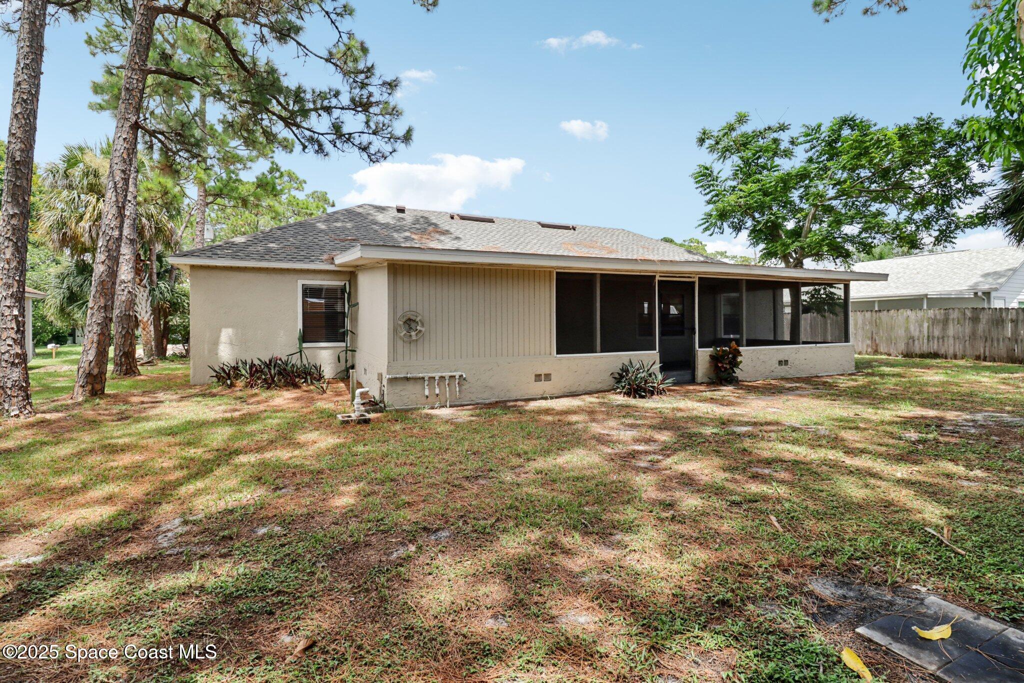 5215 Holden Road Cocoa, FL 32927 - Photo 30 of 34 a view of a house with a yard