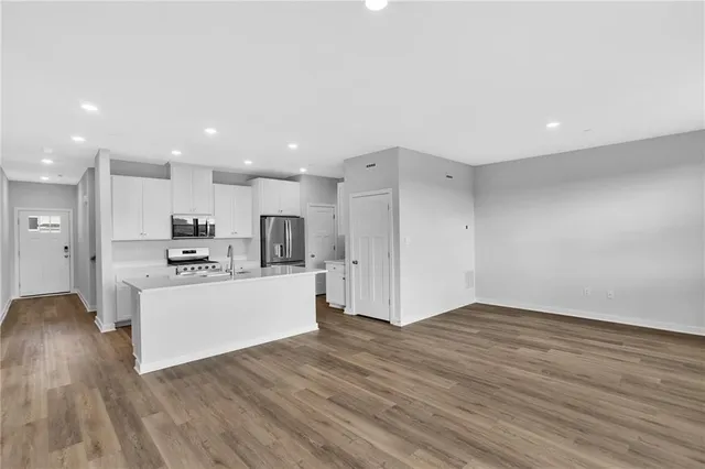 a view of kitchen with wooden floor