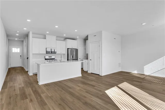 a view of kitchen with wooden floor