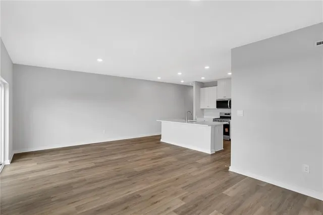 a view of kitchen with wooden floor