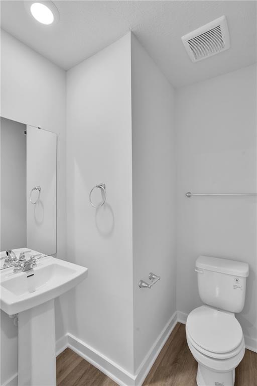 126 Scotland Lane Harmony, PA 16037 - Photo 18 of 43 a bathroom with a toilet a sink and mirror