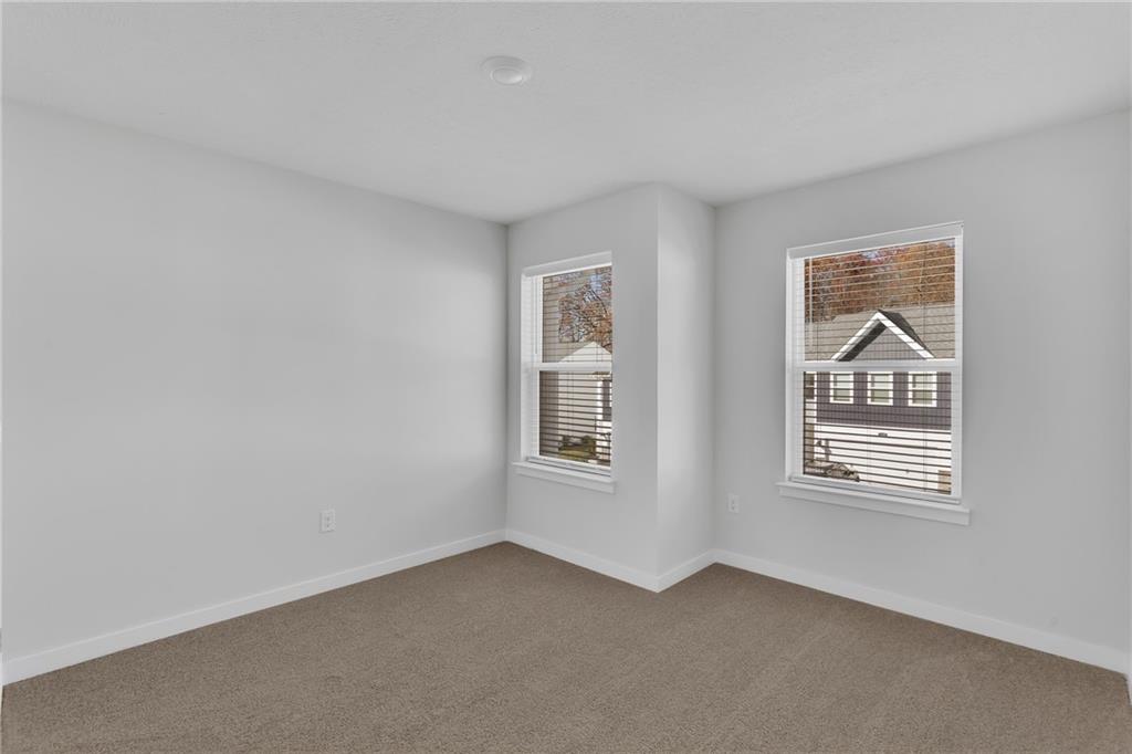 126 Scotland Lane Harmony, PA 16037 - Photo 23 of 43 a view of an empty room with windows