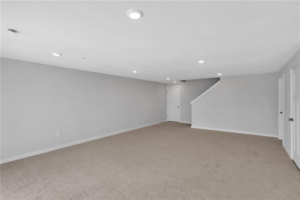 126 Scotland Lane Harmony, PA 16037 - Photo 33 of 43 an empty room with a projector and white walls