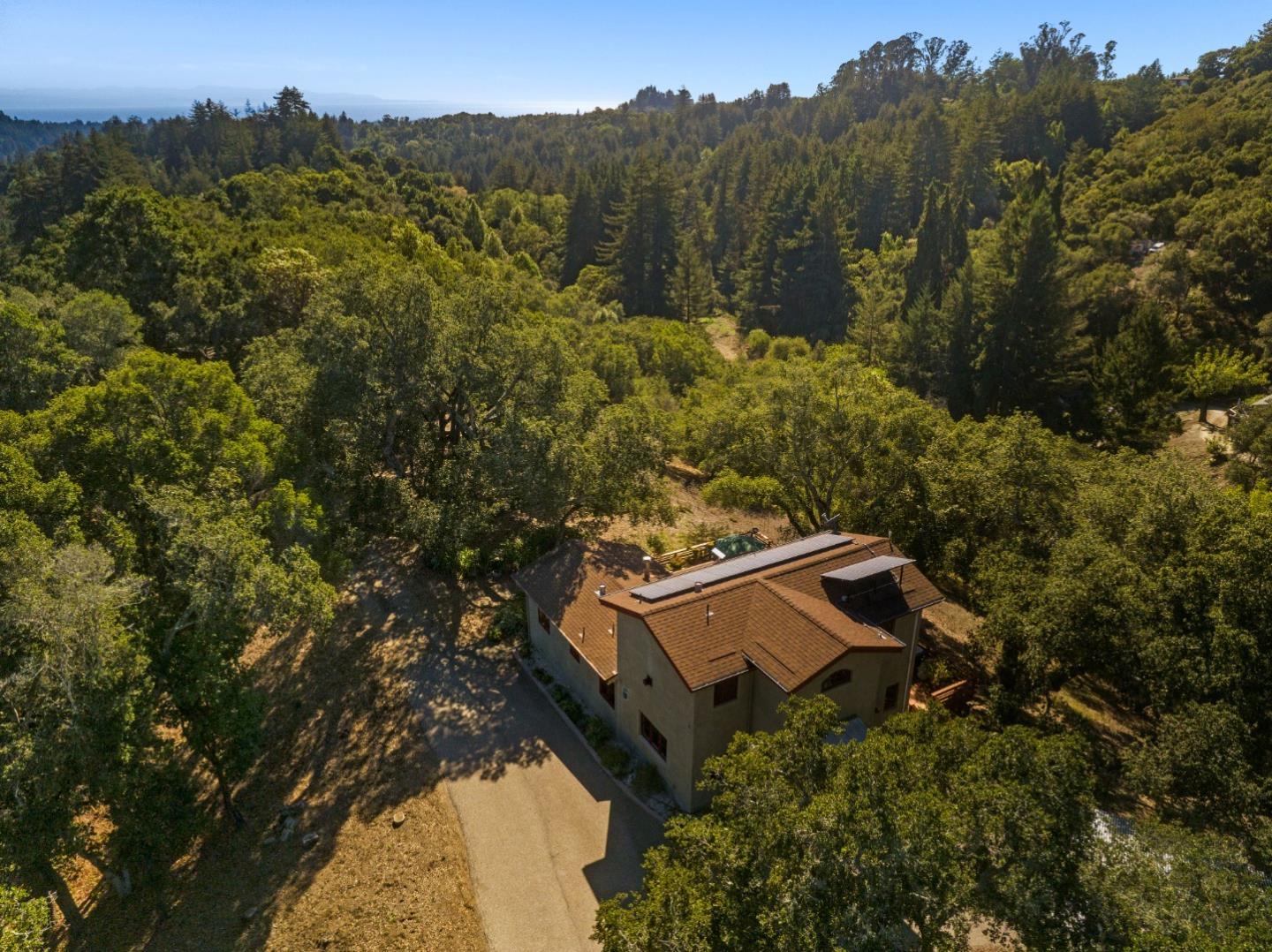 4710 North Rodeo Gulch Road Soquel, CA 95073 - Photo 2 of 97 an aerial view of a house with a yard