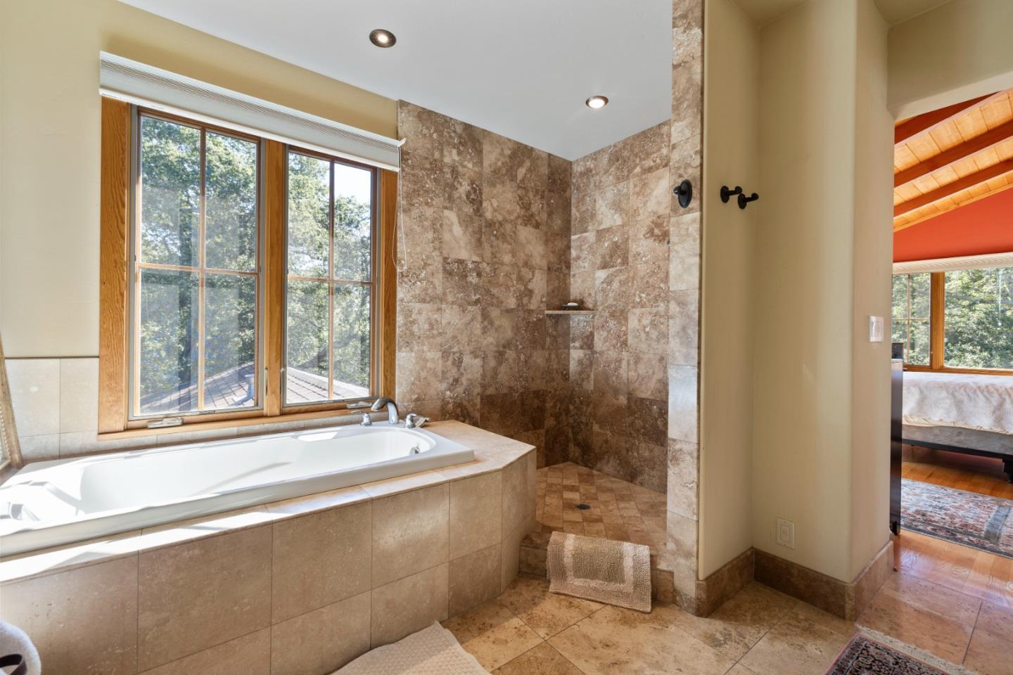 4710 North Rodeo Gulch Road Soquel, CA 95073 - Photo 28 of 97 a bathroom with a bathtub and a shower